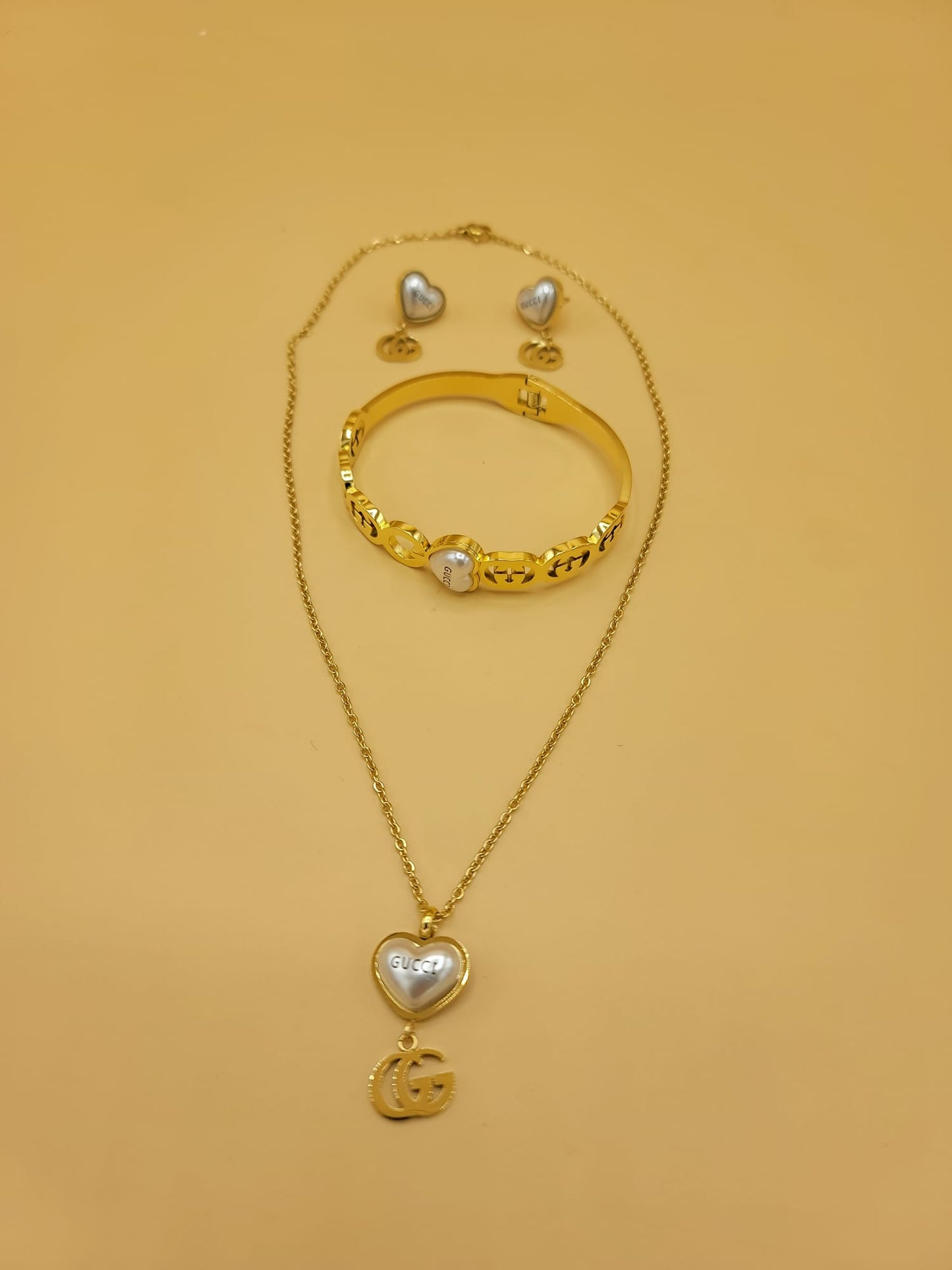 Set GG dorado y blanco