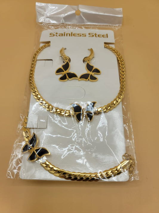Set dorado con mariposas negras